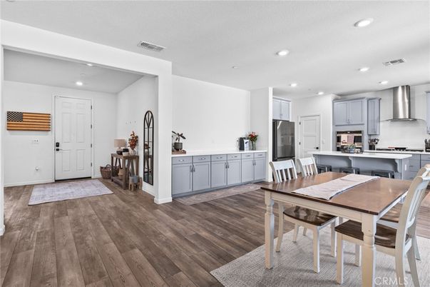 Dining room, Interior, Kitchen, Recessed Lighting, Stainless Steel Appliances, Wood Texture Flooring