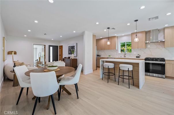 Dining room, Interior, Kitchen, Marble Walls, Pendant Lights, Recessed Lighting, Stainless Steel Appliances, Wood Texture Flooring