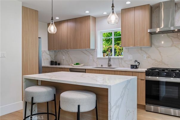 Interior, Kitchen, Marble Walls, Pendant Lights, Recessed Lighting, Stainless Steel Appliances, Wood Texture Flooring