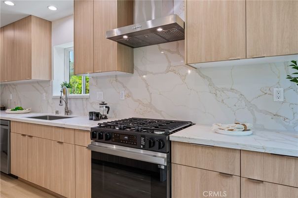 Interior, Kitchen, Marble Walls, Recessed Lighting, Stainless Steel Appliances