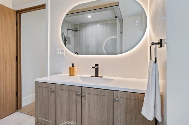 Bathroom, Dual Sink Vanities, Interior, Recessed Lighting, Wood Texture Flooring