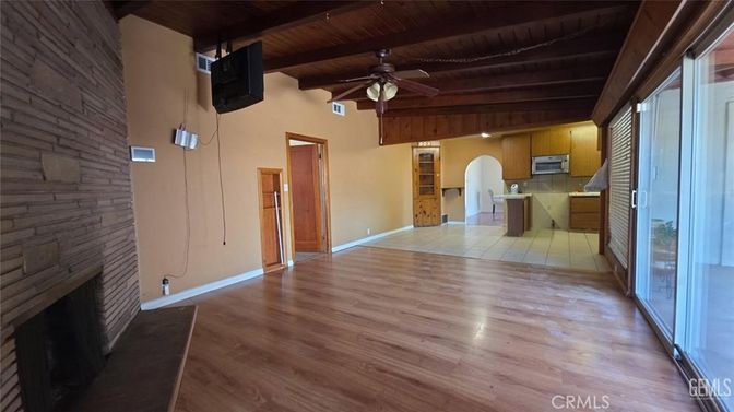 Empty room, Fireplace, Interior, Kitchen, Recessed Lighting, Stone Walls, Wooden Ceilings, Wood Texture Flooring
