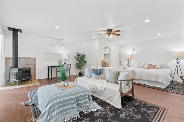 Bedroom, Fireplace, Interior, Living room, Recessed Lighting, Wood Texture Flooring