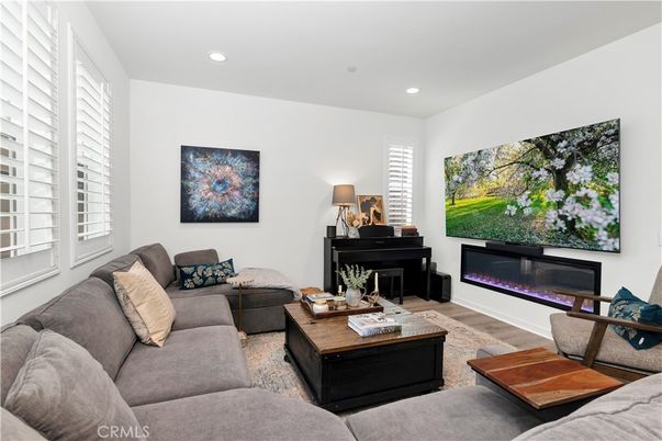 Fireplace, Interior, Living room, Piano, Recessed Lighting, Wood Texture Flooring