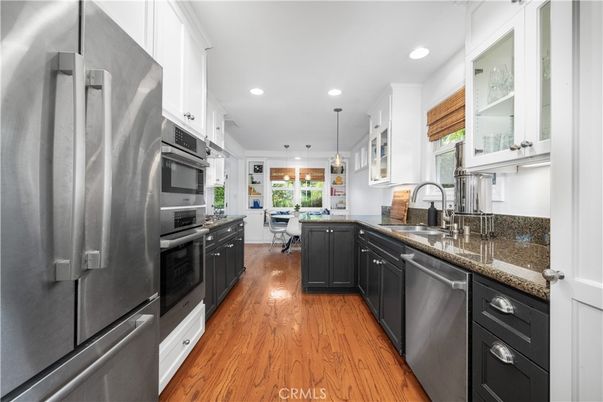 Dining room, Interior, Kitchen, Pendant Lights, Recessed Lighting, Stainless Steel Appliances, Wood Texture Flooring