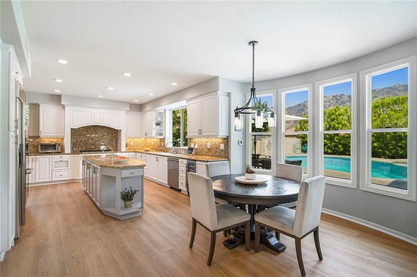 Dining room, Interior, Kitchen, Pendant Lights, Recessed Lighting, Stainless Steel Appliances, Wood Texture Flooring