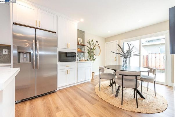 Dining room, Interior, Kitchen, Recessed Lighting, Stainless Steel Appliances, Wood Texture Flooring