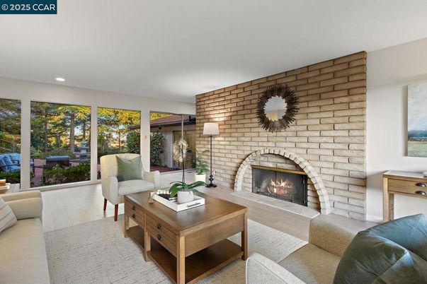 Fireplace, Interior, Living room, Recessed Lighting, Stone Walls, Wood Texture Flooring