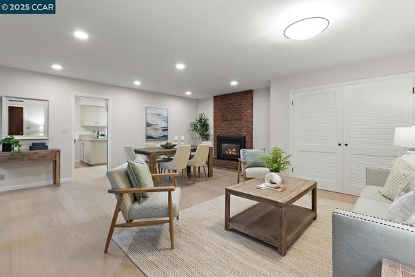 Dining room, Fireplace, Interior, Living room, Recessed Lighting, Stone Walls, Wood Texture Flooring