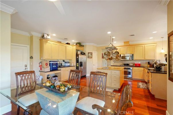 Dining room, Interior, Kitchen, Pendant Lights, Recessed Lighting, Stainless Steel Appliances, Wood Texture Flooring