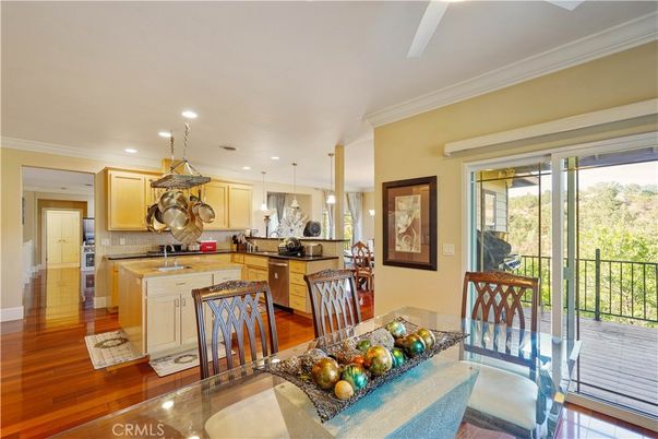 Dining room, Interior, Kitchen, Pendant Lights, Recessed Lighting, Stainless Steel Appliances, Wood Texture Flooring