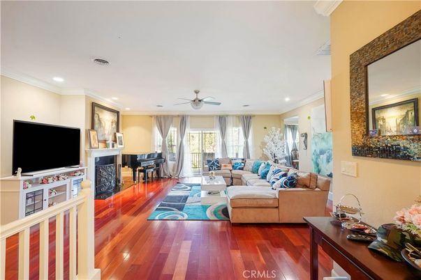 Fireplace, Interior, Living room, Piano, Recessed Lighting, Wood Texture Flooring