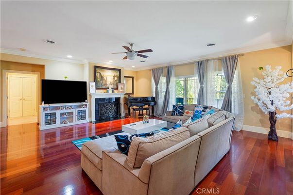 Fireplace, Interior, Living room, Piano, Recessed Lighting, Wood Texture Flooring
