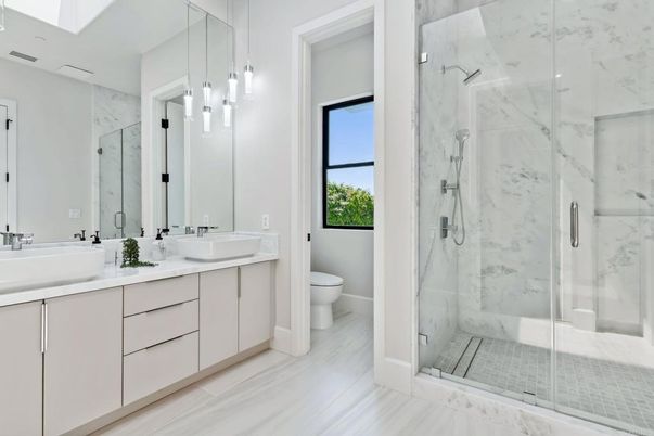 Bathroom, Dual Sink Vanities, Glass Shower, Interior, Marble, Marble Walls, Pendant Lights