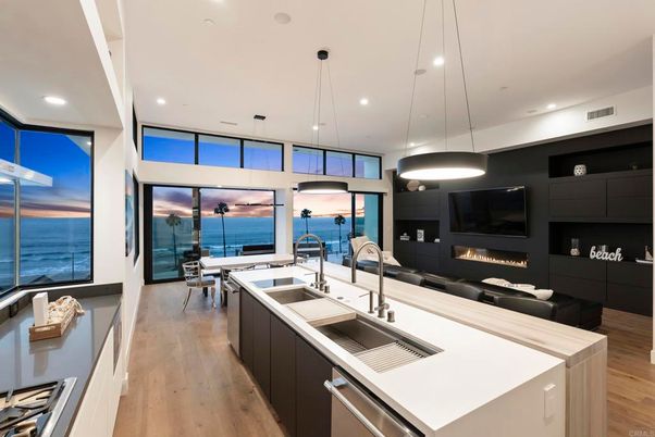 Fireplace, Interior, Kitchen, Living room, Pendant Lights, Recessed Lighting, Stainless Steel Appliances, Water, Wood Texture Flooring