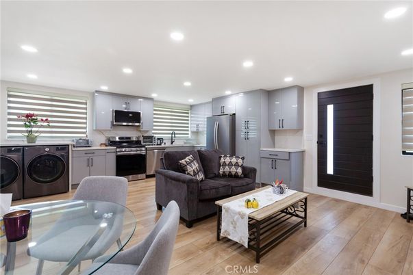 Interior, Kitchen, Living room, Recessed Lighting, Stainless Steel Appliances, Washer, Wood Texture Flooring