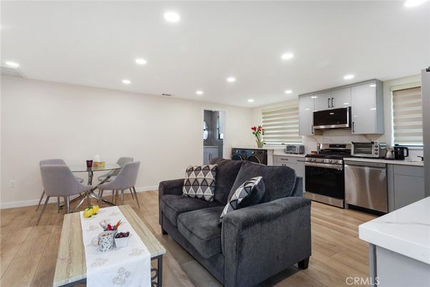 Dining room, Interior, Kitchen, Living room, Recessed Lighting, Stainless Steel Appliances, Wood Texture Flooring