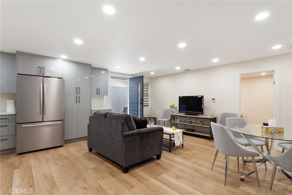 Dining room, Interior, Kitchen, Living room, Recessed Lighting, Stainless Steel Appliances, Wood Texture Flooring