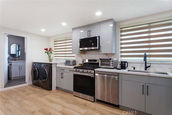 Interior, Kitchen, Recessed Lighting, Stainless Steel Appliances, Washer, Wood Texture Flooring