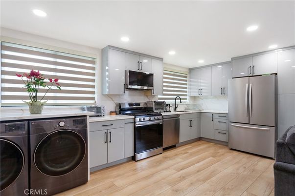 Interior, Kitchen, Recessed Lighting, Stainless Steel Appliances, Washer, Wood Texture Flooring
