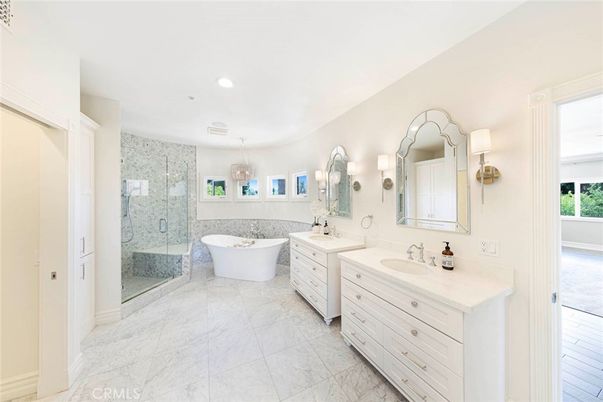 Bathroom, Chandelier, Dual Sink Vanities, Free Standing Baths, Glass Shower, Interior, Marble, Marble Walls, Recessed Lighting