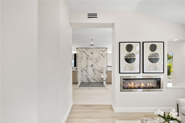 Fireplace, Interior, Marble Walls, Recessed Lighting, Wood Texture Flooring