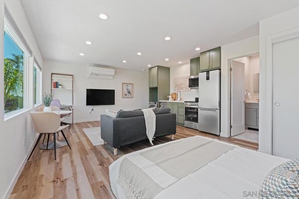 Dining room, Interior, Kitchen, Living room, Recessed Lighting, Stainless Steel Appliances, Wood Texture Flooring