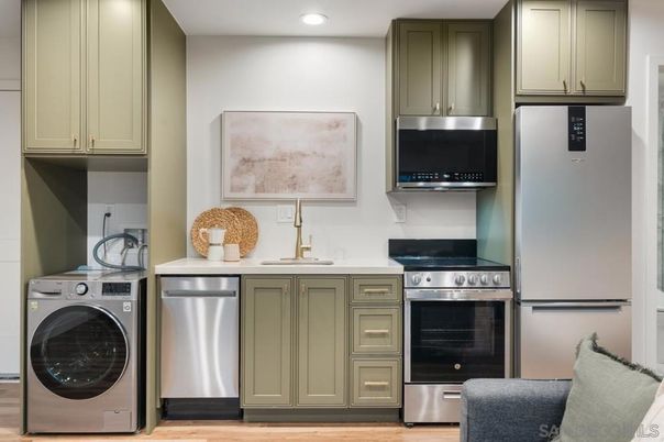 Interior, Kitchen, Recessed Lighting, Stainless Steel Appliances, Washer, Wood Texture Flooring