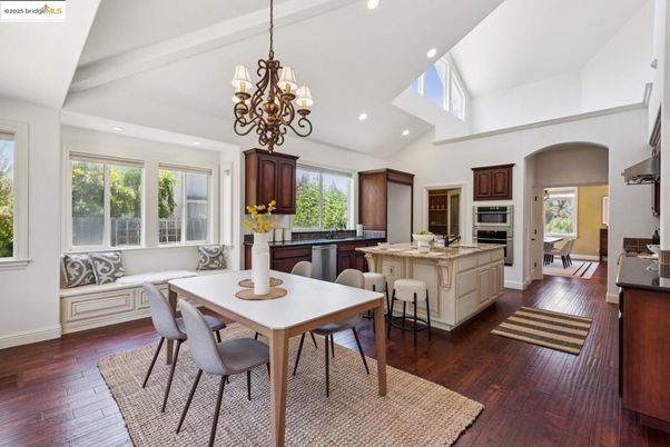 Chandelier, Dining room, Interior, Kitchen, Recessed Lighting, Stainless Steel Appliances, Wood Texture Flooring