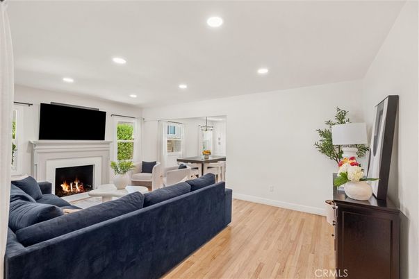Dining room, Fireplace, Interior, Living room, Pendant Lights, Recessed Lighting, Wood Texture Flooring