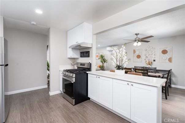 Dining room, Interior, Kitchen, Recessed Lighting, Stainless Steel Appliances, Wood Texture Flooring