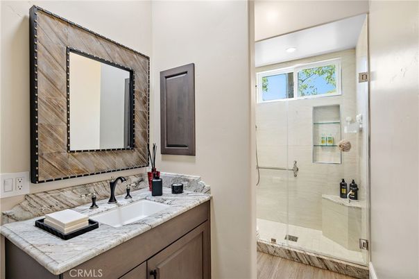 Bathroom, Glass Shower, Interior, Recessed Lighting, Tile Countertops, Wood Texture Flooring