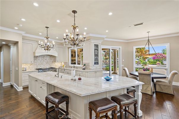 Chandelier, Dining room, Interior, Kitchen, Pendant Lights, Recessed Lighting, Stainless Steel Appliances, Wood Texture Flooring