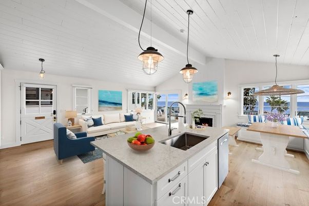 Dining room, Fireplace, Interior, Kitchen, Living room, Pendant Lights, Water, Wood Texture Flooring