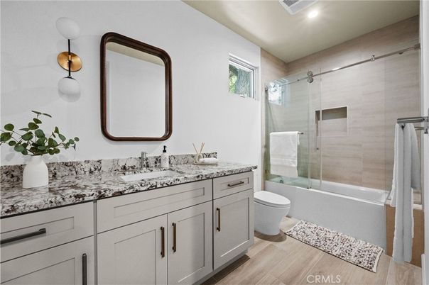 Bathroom, Dual Sink Vanities, Glass Shower, Interior, Recessed Lighting, Wood Texture Flooring