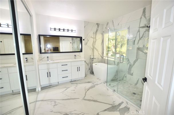 Bathroom, Dual Sink Vanities, Free Standing Baths, Glass Shower, Interior, Marble, Marble Walls