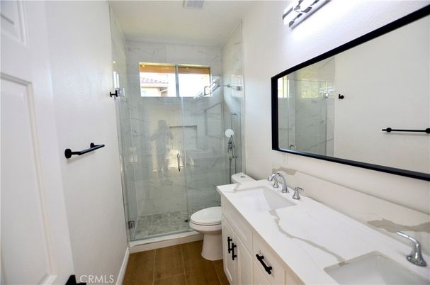 Bathroom, Glass Shower, Interior, Marble Walls, Wood Texture Flooring