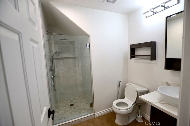Bathroom, Glass Shower, Interior, Marble Walls, Wood Texture Flooring