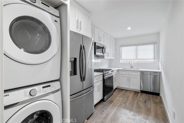 Interior, Kitchen, Recessed Lighting, Stainless Steel Appliances, Washer, Wood Texture Flooring