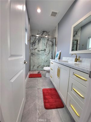 Bathroom, Dual Sink Vanities, Glass Shower, Interior, Marble Walls, Recessed Lighting