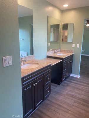 Bathroom, Dual Sink Vanities, Interior, Recessed Lighting, Wood Texture Flooring