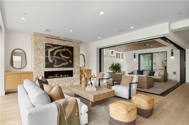 Fireplace, Interior, Living room, Recessed Lighting, Stone Walls, Wood Texture Flooring