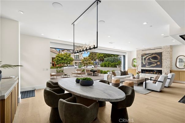 Dining room, Fireplace, Interior, Living room, Pendant Lights, Recessed Lighting, Wood Texture Flooring