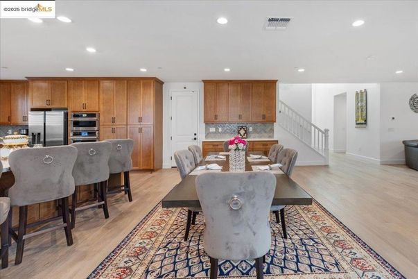 Dining room, Interior, Kitchen, Recessed Lighting, Stainless Steel Appliances, Wood Texture Flooring
