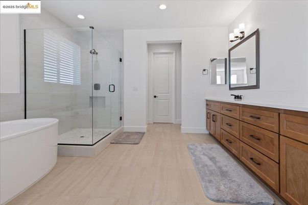 Bathroom, Dual Sink Vanities, Glass Shower, Interior, Recessed Lighting, Wood Texture Flooring