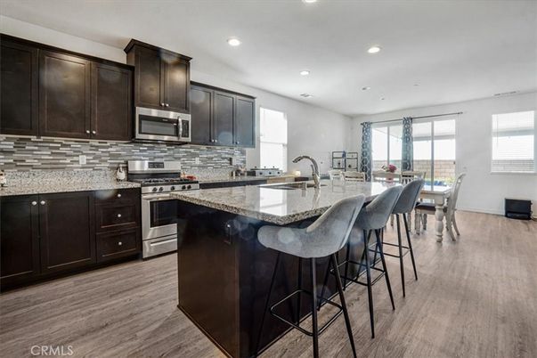 Dining room, Interior, Kitchen, Recessed Lighting, Stainless Steel Appliances, Wood Texture Flooring