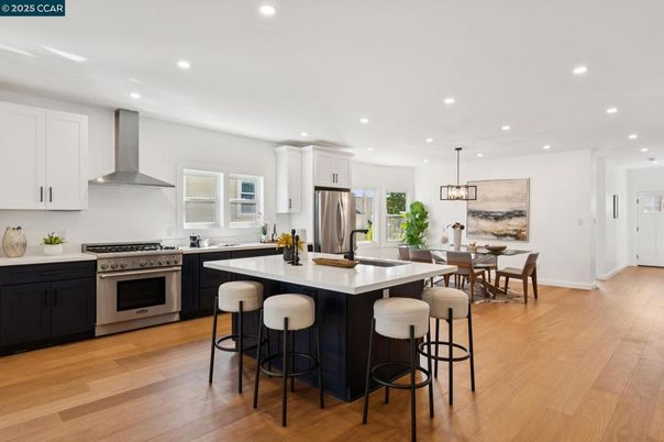 Dining room, Interior, Kitchen, Pendant Lights, Recessed Lighting, Stainless Steel Appliances, Wood Texture Flooring