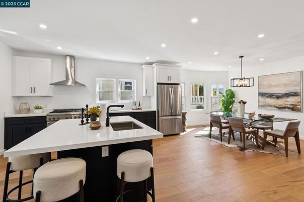 Dining room, Interior, Kitchen, Pendant Lights, Recessed Lighting, Stainless Steel Appliances, Wood Texture Flooring