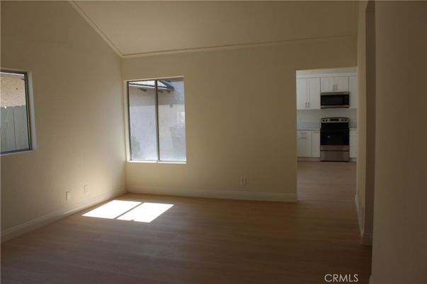 Empty room, Interior, Kitchen, Stainless Steel Appliances, Wood Texture Flooring