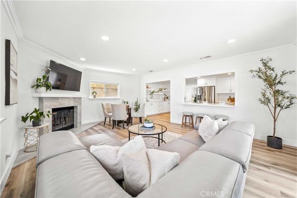 Dining room, Fireplace, Interior, Kitchen, Living room, Recessed Lighting, Stainless Steel Appliances, Wood Texture Flooring